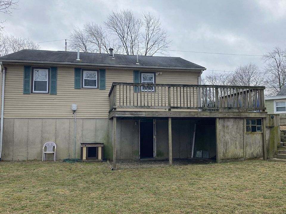 Back of house with deck