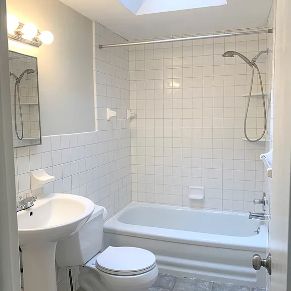 Upper level full bathroom with opening skylight