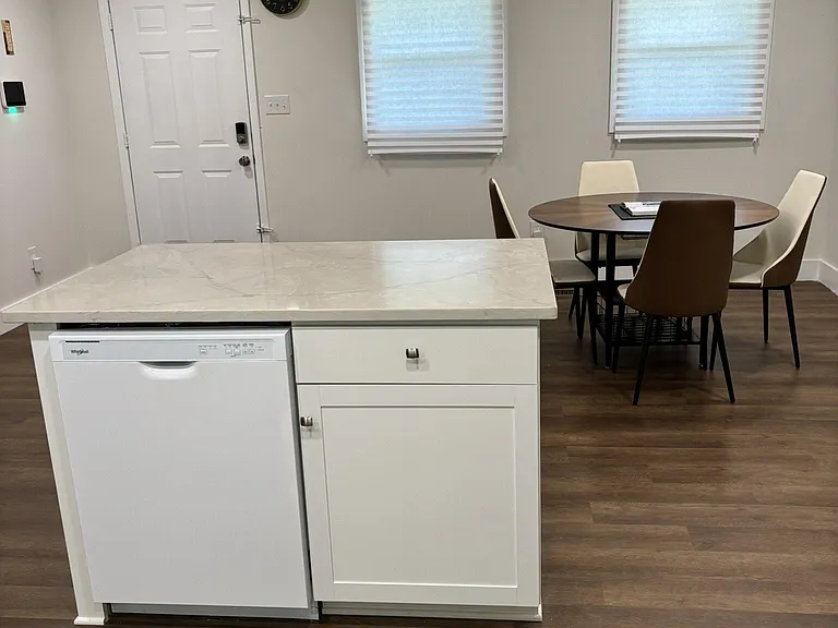 Kitchen island dishwasher, Quartz counters opens to a dining nook, with recessed lighting, ceiling fan, and window shades.