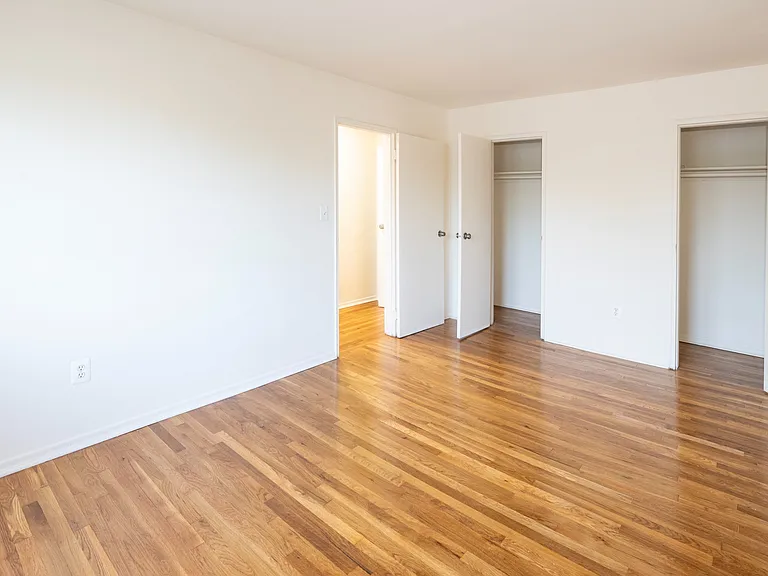 Elevate your living in Dorchester House Apartments. This spacious room features beautiful hardwood floors and ample natural light, perfect for creating your ideal living space. Schedule a tour today to see your future home!