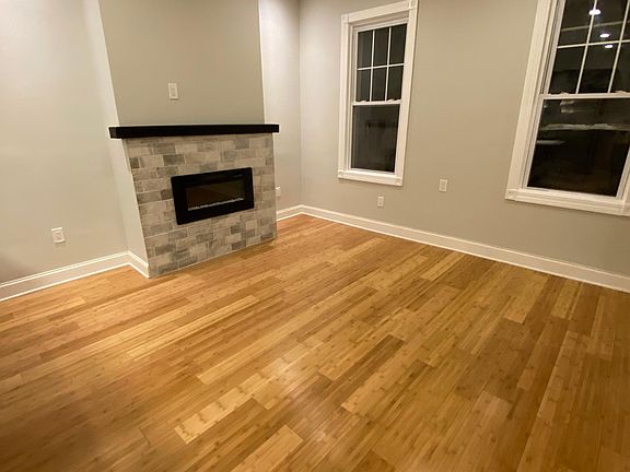 Side View of Living room with modern energy efficient electric fire place.