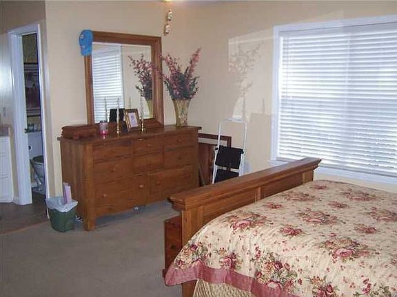 Master bedroom w/ vaulted ceiling