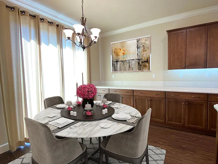 Bright dining area conveniently located adjacent to the kitchen and living room.