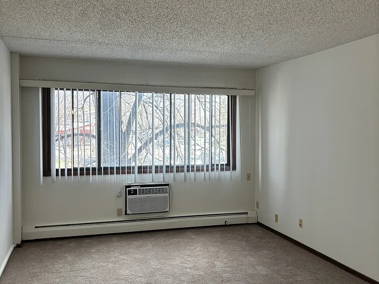 Living Room with Wall Unit Air Conditioning