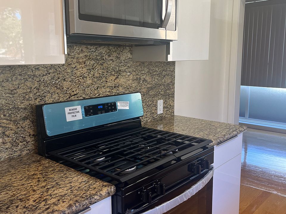 Kitchen NEW stainless-steel appliances including stove & microwave