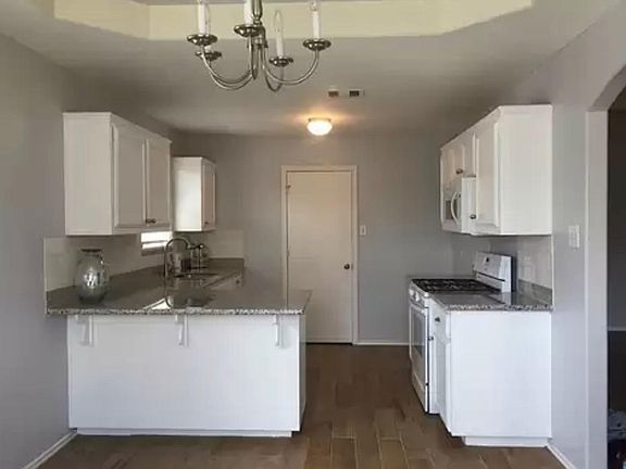 Breakfast Area & Kitchen - Door to Laundry Room and Garage