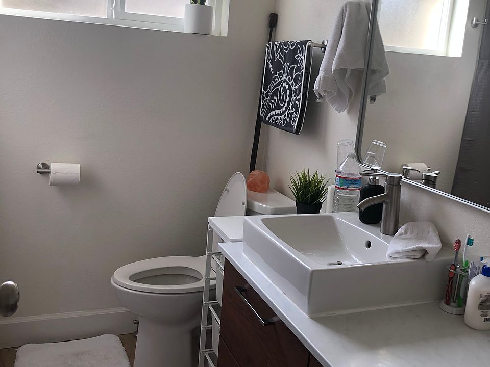 Interior of a furnished bathroom. Same great amenities and style in the available unit, without the decor!