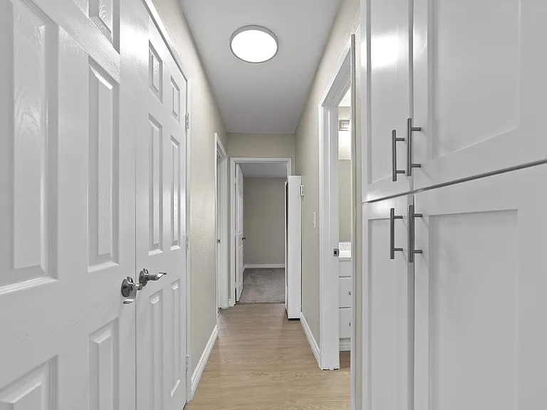 Storage closet and upgraded cabinets at Strada Apartments in Orange, CA