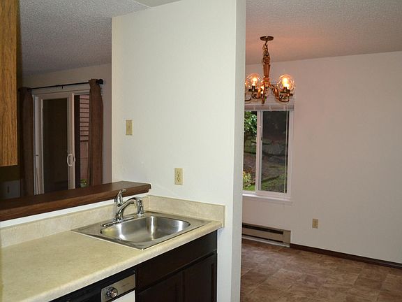 Kitchen looking through to the Dining Room with peek through to Family Room
