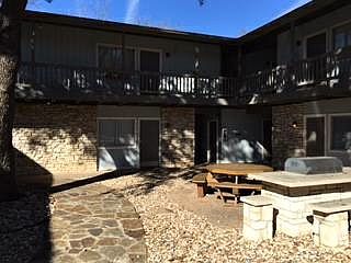 Front of Building. Apt 5 is in front of the patio and grill