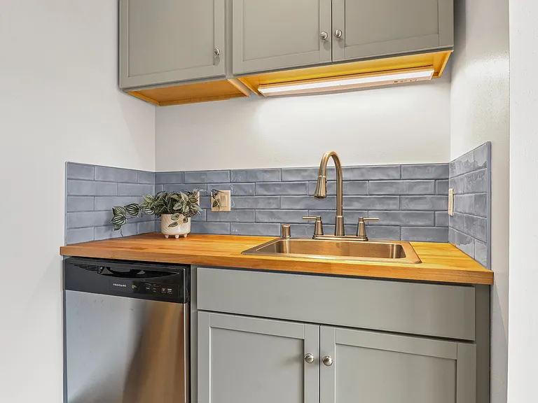 HELLO DISHWASHER!! This well appointed kitchen also has a swan neck sink for ease.