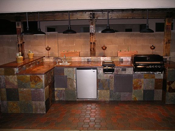 slate and copper BBQ with sink, fridge, sit up bar