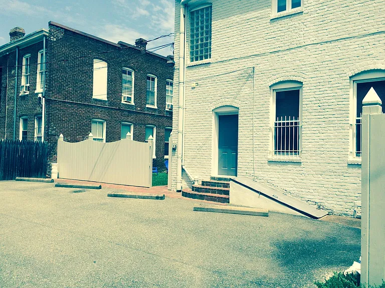 PARKING LOT; ONE PARKING SPACE PER TENANT