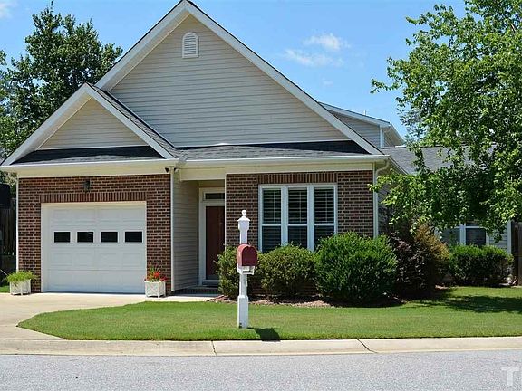 Home has Front Entry One Car Garage with a Concrete Drive.