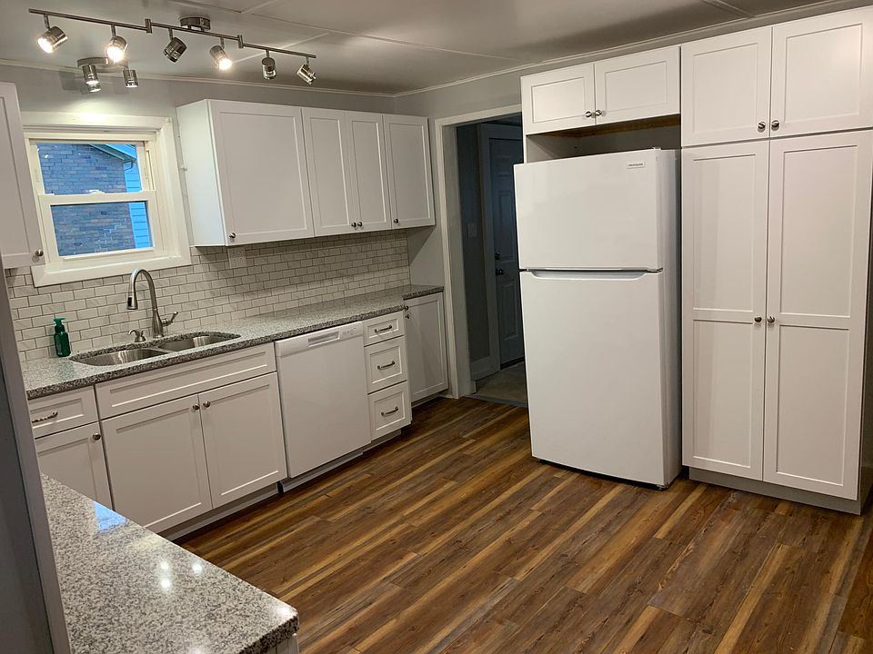 Brand new kitchen that includes a pantry with sliding shelves.