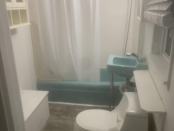 Bathroom with new luxury plank flooring.