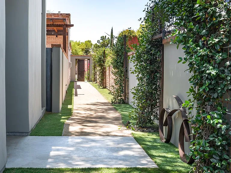 Pathway from secure steel gate to entry door