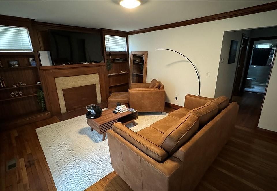 A spacious living room looking over a front porch