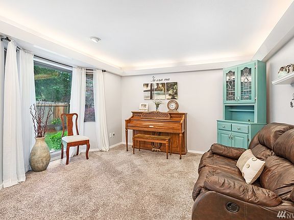 Formal living room off the entry has cove lighting