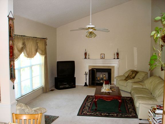 Cathedral Ceiling in Family Room w Marble Suround on Fireplace