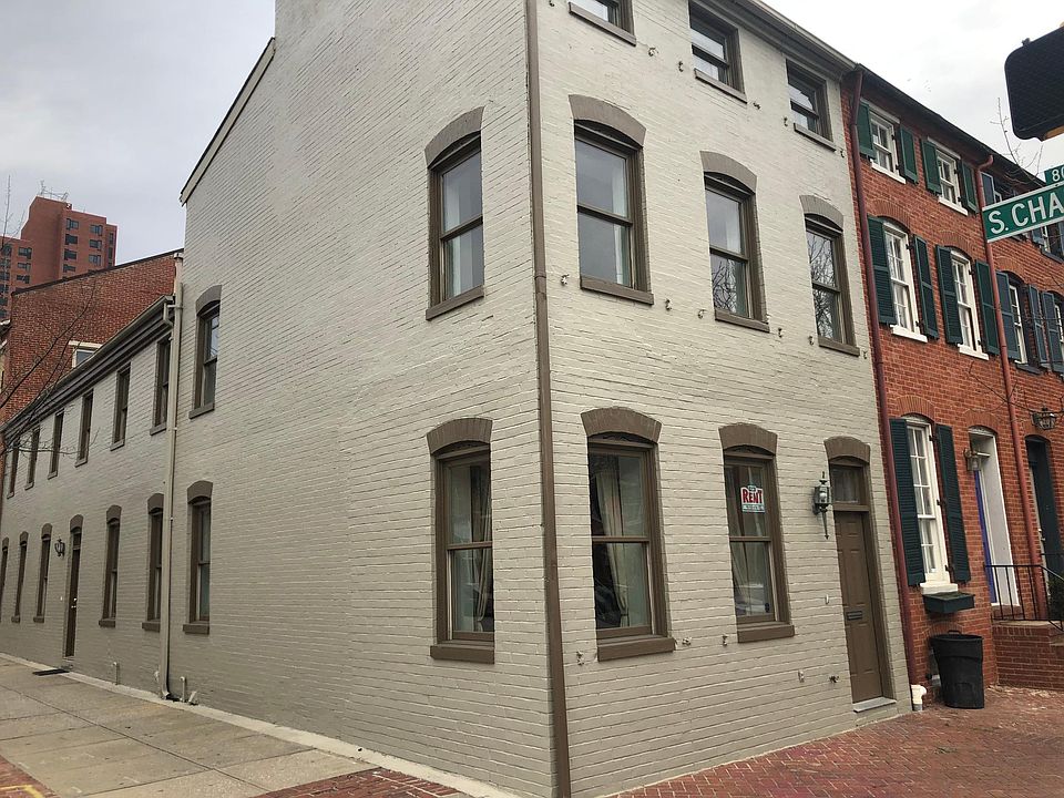 Closeup of exterior of this very wide, corner townhouse. This house is very well maintained and offers great space for roommates or a couple with children.