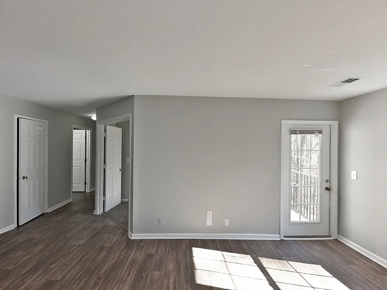 Spacious living room with hardwood-style flooring