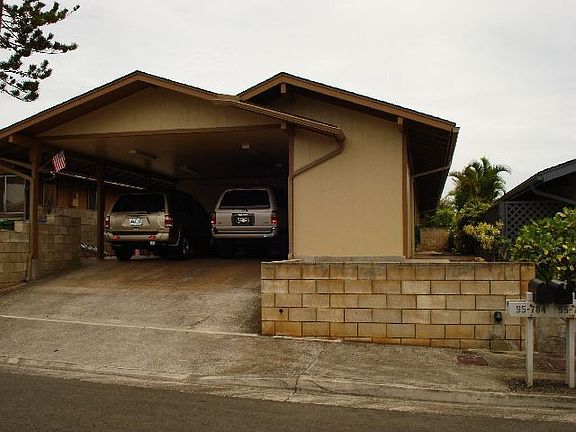 Front of home w/extended carport