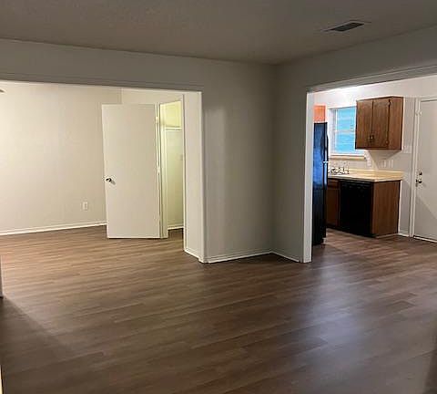 Open Living Room to Second large living area and kitchen / dining areas.
