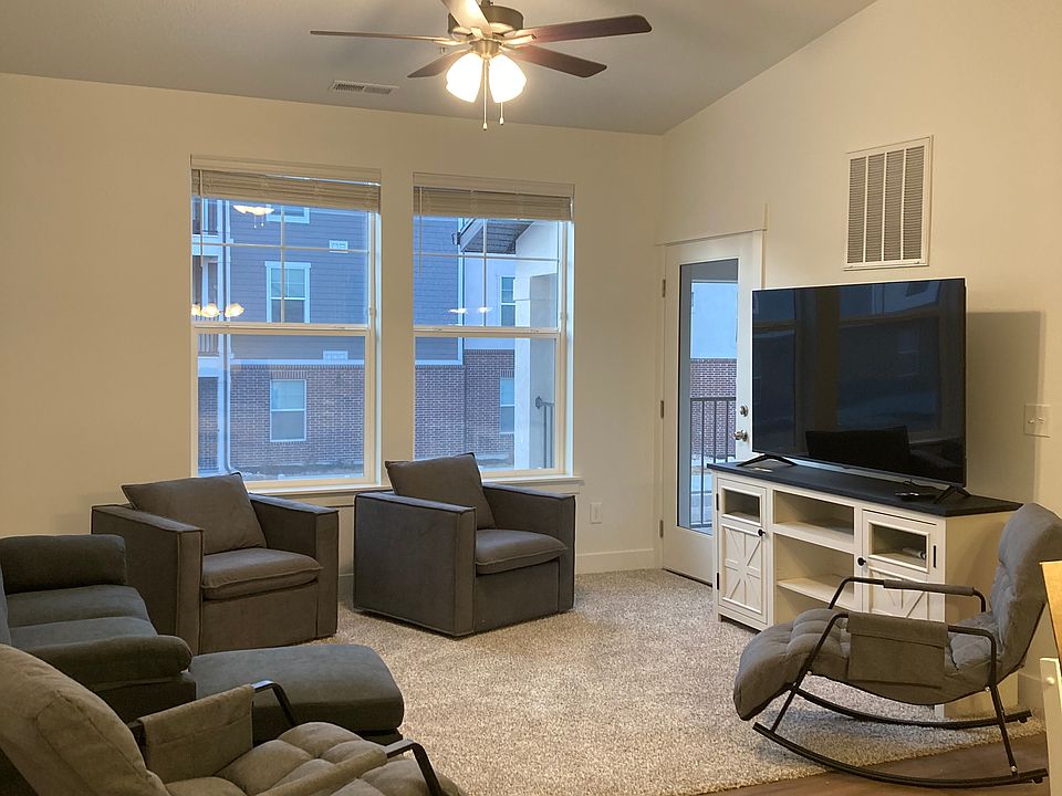 Living room shown with indoor-outdoor rocking recliners