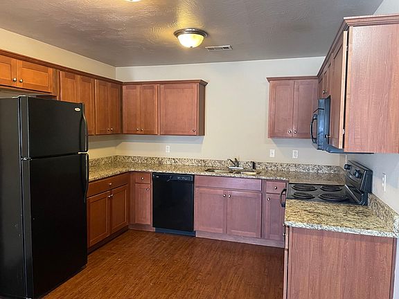 kitchen area - included appliances are refrigerator, dishwasher, stove and microwave.