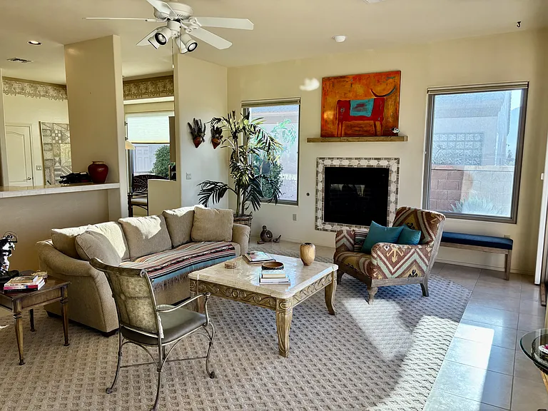 View of living room with gas fireplace.