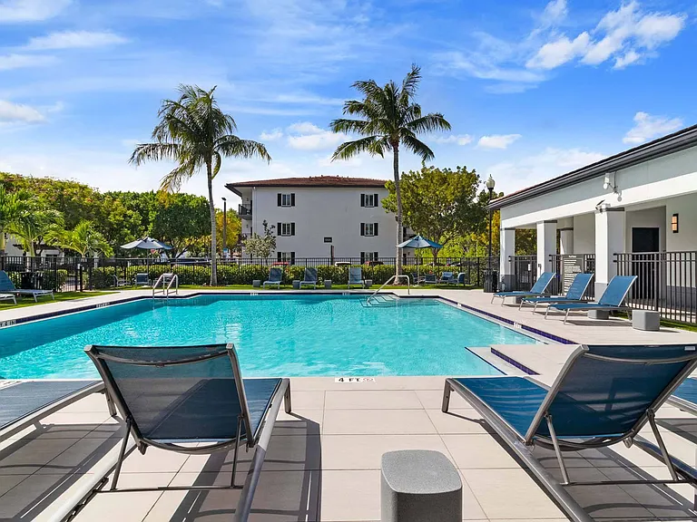 Stretch out on a lounger and enjoy an easy moment of relaxation by the pool.