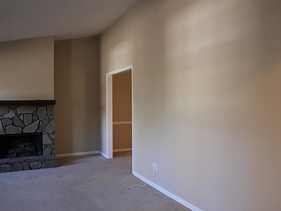 Great Living room with stone fireplace - view 2