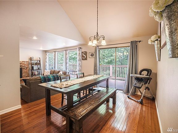 Dining room with beautiful hardwood floors and sliders leading to your large deck. 