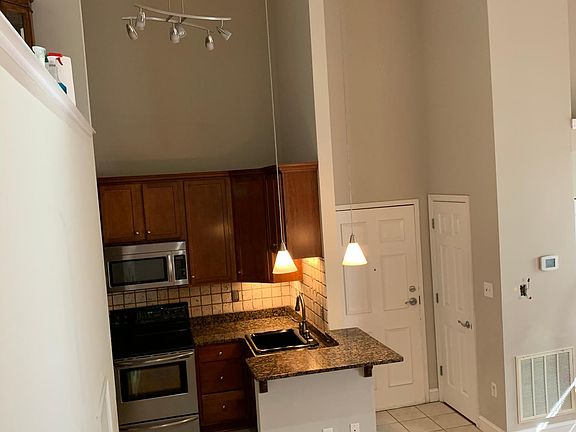 Kitchen and front door view from stair case