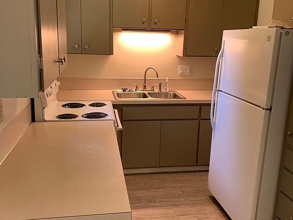 Kitchen. Has a window looking out to backyard.