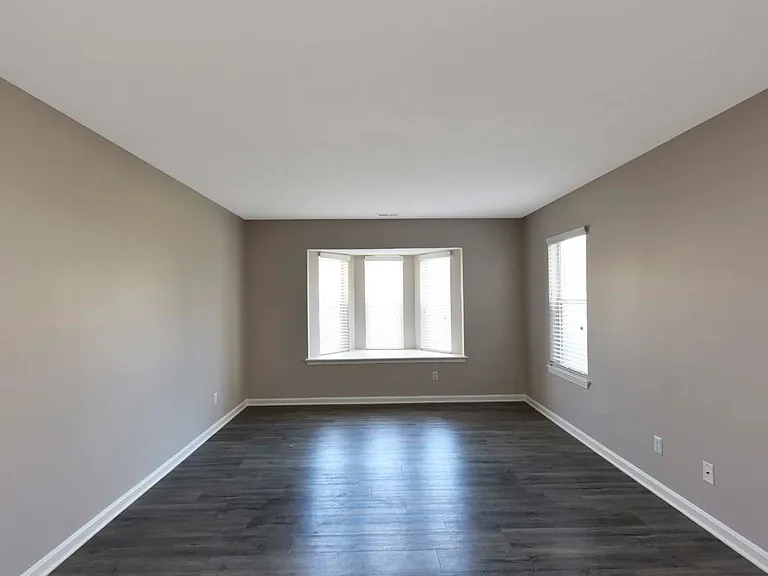 Spacious Living Room + Bay Window