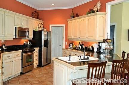 Kitchen
						:
						Tile floors, granite counters, stainless appliances, crown molding, recess light