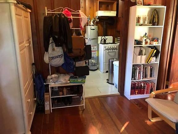 View of. thekitchen entryway and the bedroom door from the living room