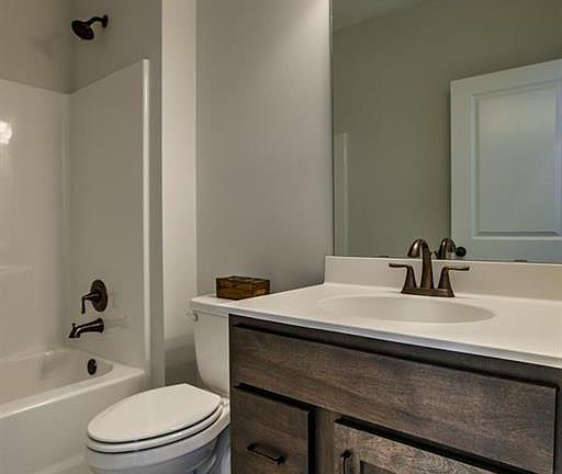 Gorgeous stained vanity and oil rubbed bronze light fixtures.