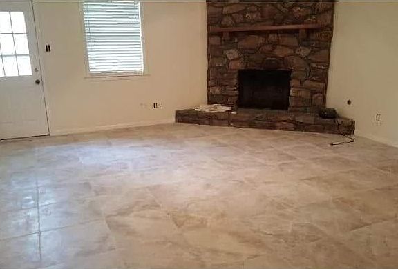 New tile in Family room. Woodburning fireplace.