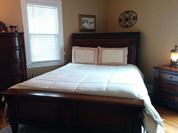 Main bedroom with ceiling fan and small closet.