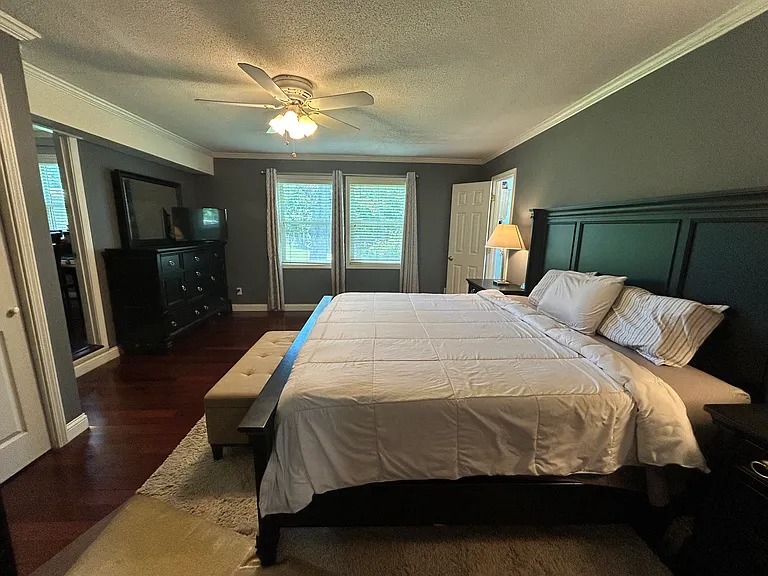 Another view of the Master Bedroom and the two large windows that provide a wonderful view of the backyard.