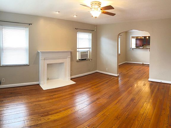 Spacious living room with hardwood floors