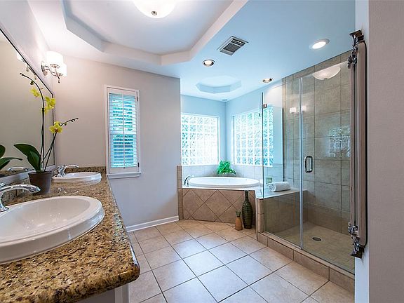 Large master bath with separate tub/shower and double sink vanity.