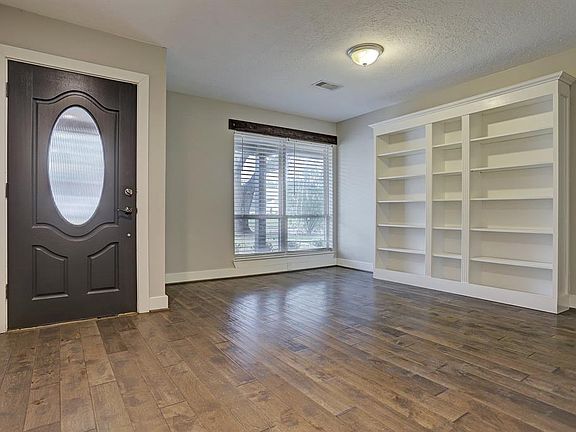 Two separate living areas provide great functionality with the space. The front living area features great natural light and built in bookshelves.