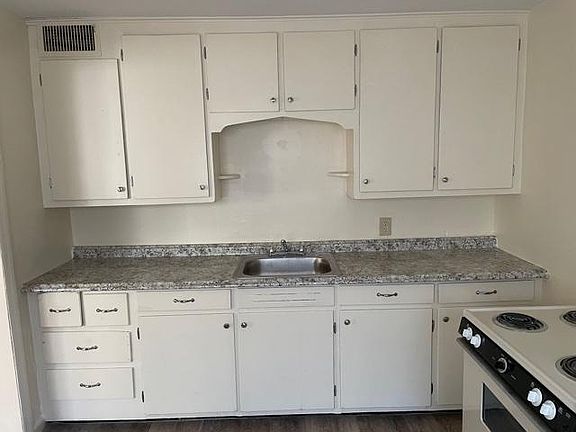 New countertop, sink and refinished cabinets