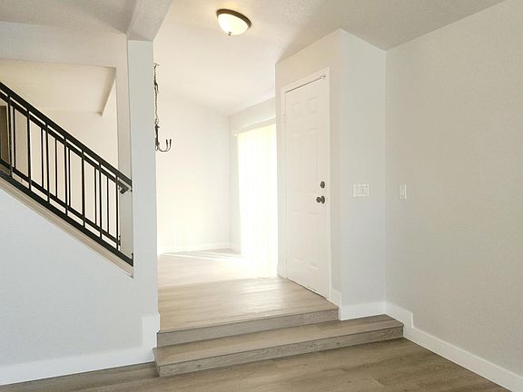 Black modern fixtures, vinyl plank flooring.