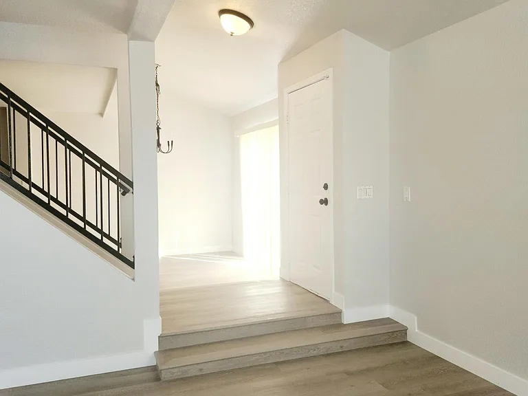 Black modern fixtures, vinyl plank flooring.