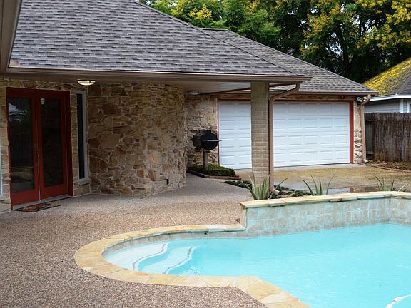 POOL SITS IN FRONT YARD